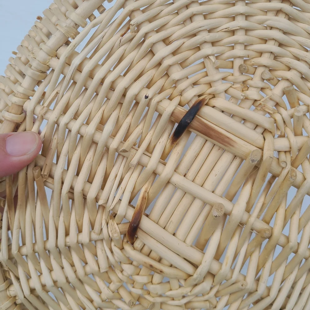 Woven wicker basket with faux leather handles